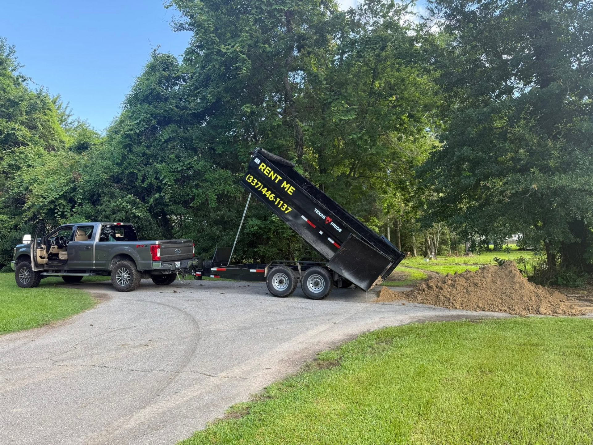 Cajun Pro dump trailer in action